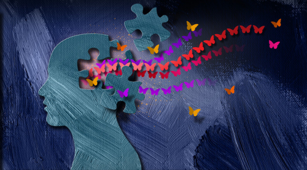 Illustration of a blue-gray head in profile with puzzle pieces removed and colorful butterflies streaming away from it; concept is dementia